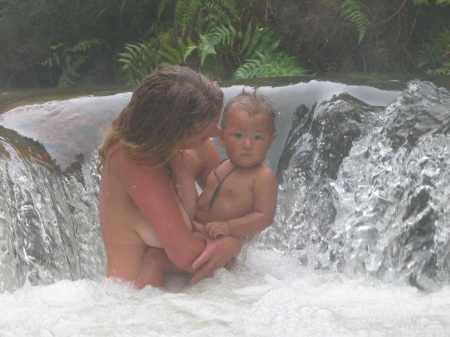 A mother and her babe enjoying the small hot waterfall  at Kerosene Creek.