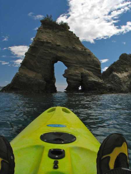 Paddling a hire kayak from the Tolaga campground out to the Mitre Rocks Islands.