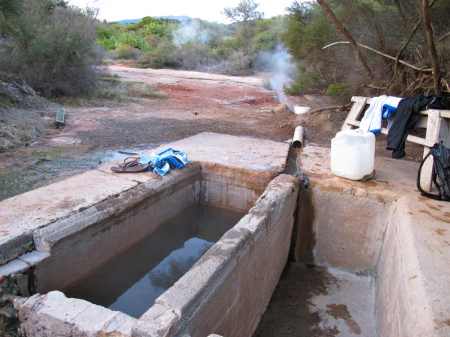 The two tubs with the steaming geyser behind