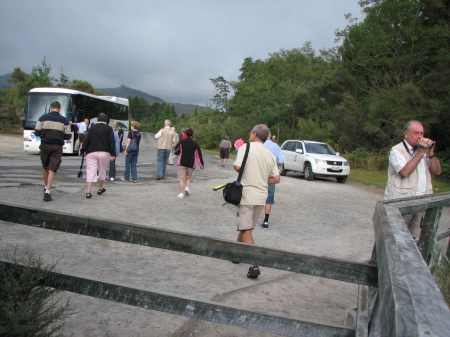 Tourists returning to their bus after their 30-second photo-op stop.
