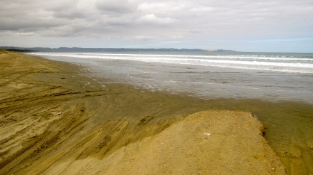 Waipapakauri pavement ending onto the wetsands of 90-Mile Beach