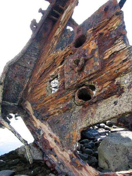 Wooden planking is still attached to the rusting bow of the Gairloch.  Amazing!